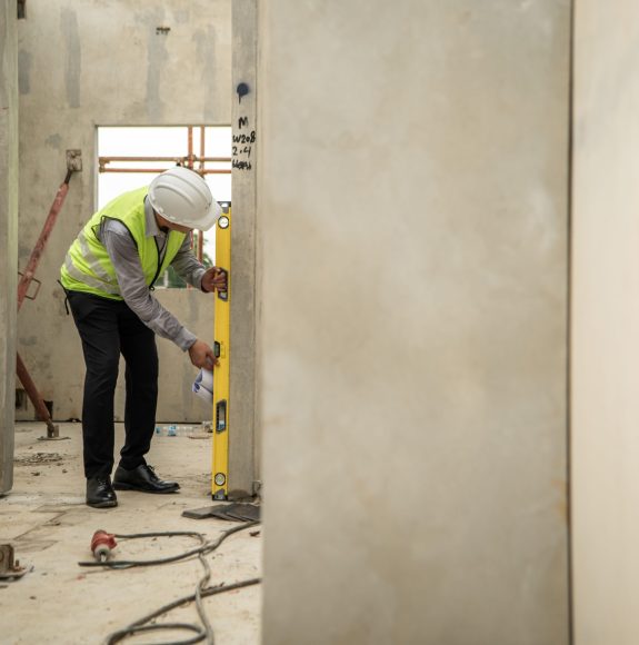 Engineers construction projects inspect and supervise the construction of building walls and foundations of residential buildings